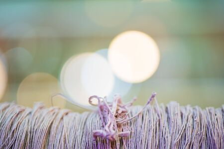 Close up thread linen fabric on Bokeh Light background with copy spaceの写真素材