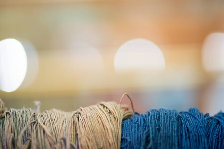 Close up thread linen fabric on Bokeh Light background with copy spaceの写真素材