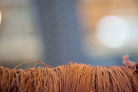 Close up thread linen fabric on Bokeh Light background with copy spaceの写真素材
