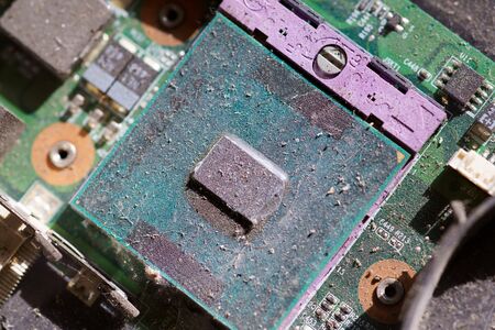 Close-up computer Processer Electronic Chipset on Motherboard is covered with dustの写真素材