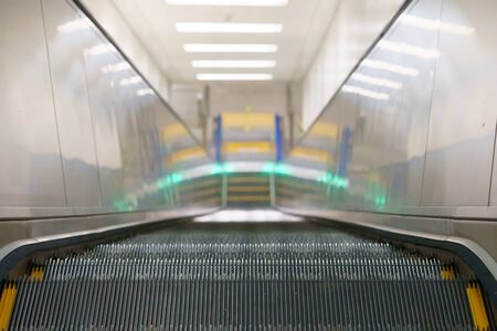 Top view of long empty escalator in a train stationの写真素材