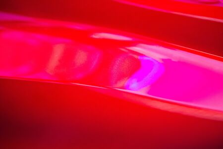 red metallic car paint surface wallpaper backgroundの写真素材