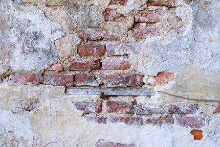 Abstract retro Old wall brick cracks red color backgroundの写真素材