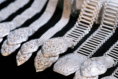 Beautiful vintage silver belts pattern detailed thai style fashion close upの写真素材