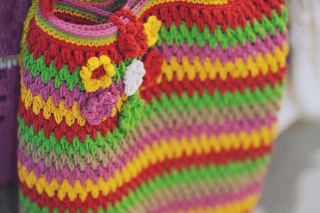 Fashion Colorful crochet bag handmade texture backgroundの写真素材