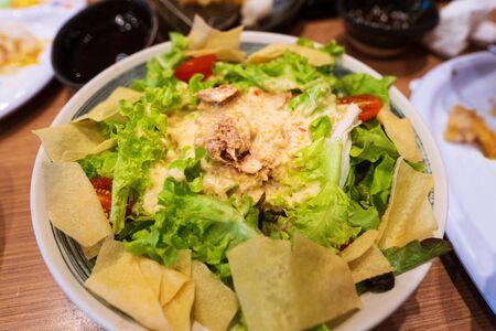 Close up Fresh mixed vegetables and Tuna salad into a bowl thai street food marketの写真素材