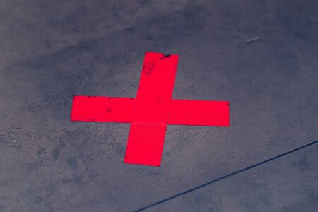 Red sticker floor sign warning safety your distance coronavirus outbreak social distancing publicの写真素材