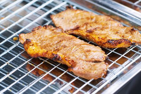 Close up of Grilled pork neck thai street food marketの写真素材