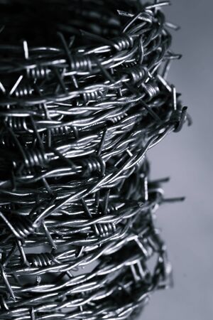 Blurred Black and whith Close up of barbed or barb wire backgroundの写真素材