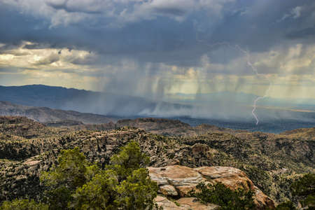Monsoon rain falling over the valley of Tucson, Arizonaの写真素材