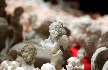 White Angel Ornaments at a Christmas Marketの写真素材