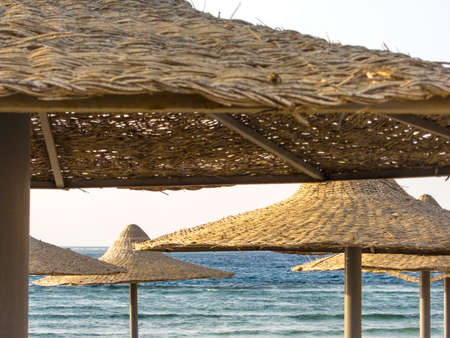 Bast Sunshades on a Beach in Egypt, obstruct the view on the Red Seaの写真素材