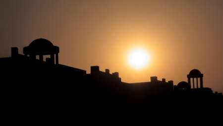 Sun setting over the silhouette of a resort hotel on the Egyptian Coast near Marsa Alam の写真素材