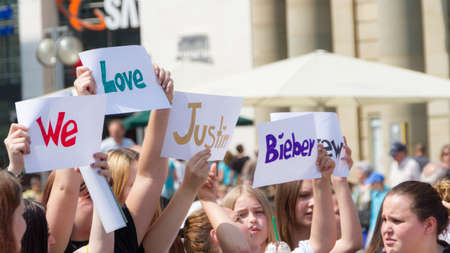 Stuttgart, Germany - July 13th 2013 - Teenage girls demonstrate for their idol, Justin Bieber on July 13th, 2013 in Stuttgart.のeditorial素材