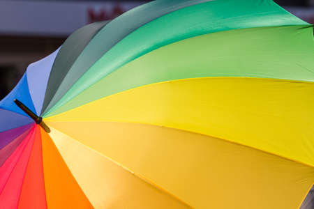 Format filling rainbow-colored umbrella as a symbol for tolerance