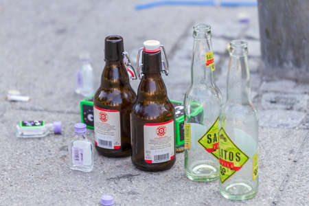 Empty beer and shot bottles on the ground after the   Christopher Street Day  CSD  parade in Stuttgart in July 2013 のeditorial素材