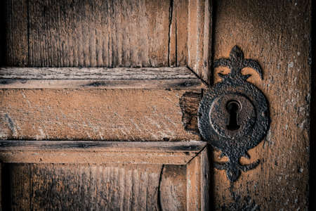 Closeup of the lock of an ancient door in a medieval castleの写真素材