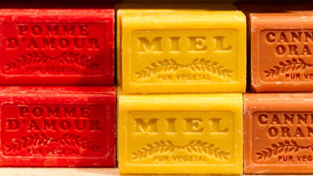 Bars of honey soap and other natural soaps at a marketのeditorial素材