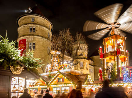 Stuttgart, Germany - December 21, 2013 - People stroll over the Christmas Market checking out the stalls next to the Old Palace (Altes Schloss) at night on December 21, 2013 in Stuttgart.のeditorial素材