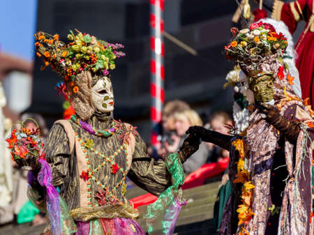 Schwaebisch-Hall, Germany - February 23, 2014 - Two people, dressed up in a Venetian style fall-themed costume dance on Hallia Venetia Carnival festival on February 23, 2014 in Schw?bisch-Hall.のeditorial素材
