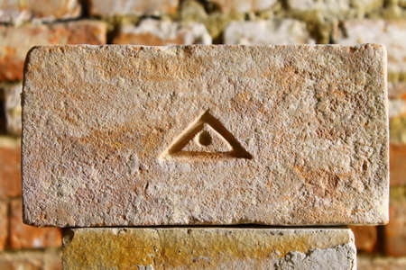 The eye of Providence on old brick