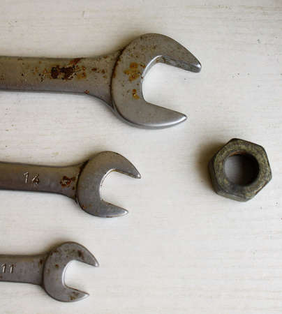 Three wrenches and nutの写真素材