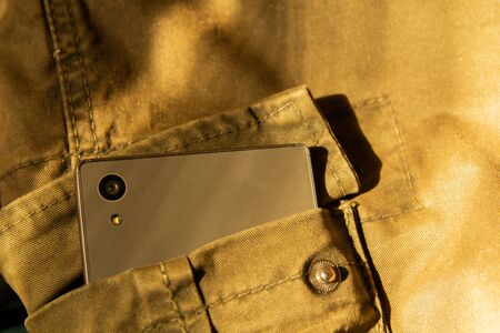 Modern smartphone in jeans pocket. Digital gadgets concept.の写真素材