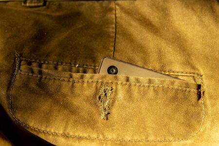Modern smartphone in jeans pocket. Digital gadgets concept.の写真素材
