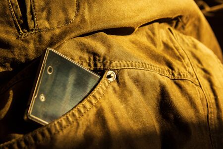 Modern smartphone in jeans pocket. Digital gadgets concept.の写真素材