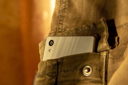 Modern smartphone in jeans pocket. Digital gadgets concept.の写真素材