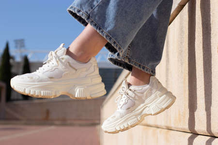 Girl wearing white shoes in Barcelonaの写真素材