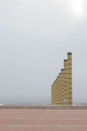 Barcelona, Catalonia  Spain; April 20 2021: Columns next to the Montjuic Communications Tower by Santiago Calatrava (1991) and street lamps in the Anella Olimpica.のeditorial素材