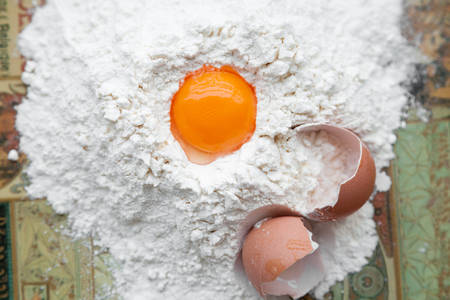 Eggs in a pile of flour