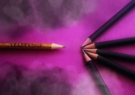 One pencil standing out before the group of other pencil.Leadership and growth in business concept.の写真素材