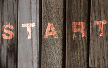Start word on wooden fence background. Business startup concept.の写真素材