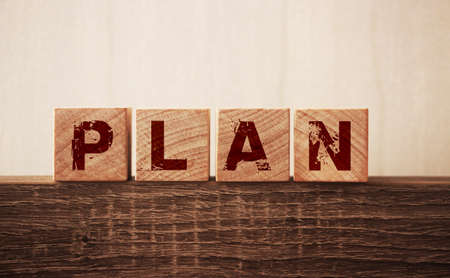Plan word on wooden blocks on woode table. Business strategy concept.の写真素材