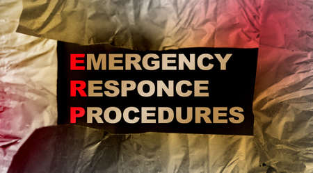 ERP as Emergency Response Procedures written under torn paper. Concept image of Business Acronym...