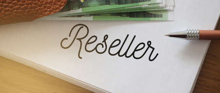 Reseller word on a page of copybook, 100 Euro banknotes and a pen. Sales business concept.の写真素材
