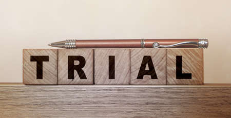 Trial Word In Wooden Cubes. Free version to attract more clients business concept.の写真素材