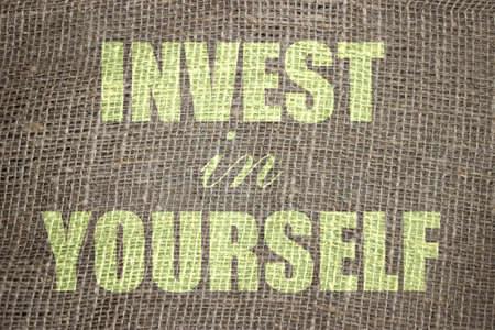 Invest In Yourself .words printed on burlap canvas. Business and career concept for Self Motivation.の写真素材