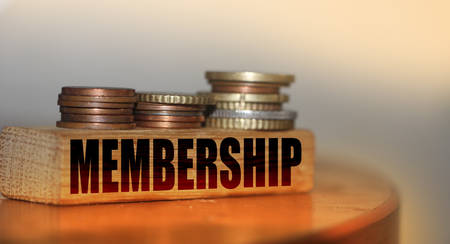 Memebership word on building blocks and stacks of coins. VIP business special services concept.の写真素材