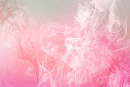 Beautiful dreamy sky with soft pink and mint clouds and smoke over them. Abstract romantic background for party posters and flyers.の写真素材