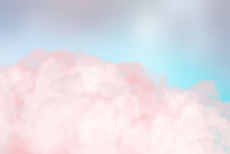 Dreamy soft pink clouds closeup reminding colored pink smoke in blue sky. Romantic background.の写真素材