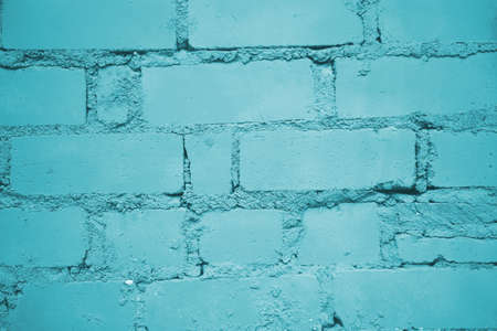 Painted into teal green Brick wall background closeup.