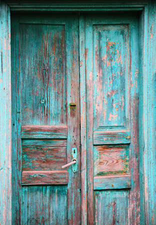 old antique vintage wooden weathered door closeup.の写真素材