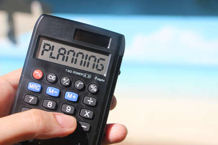Calculator text Planning on display. Tourism business concept. Freelance, distant work career concept.の写真素材