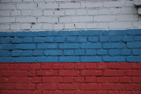 Flag of Russia painted onto a grunge brick wall.の写真素材