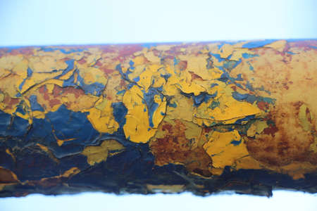 Blue painted metal with a rust texture.