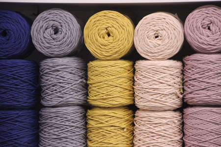 t-shirt yarn balls light gray color on brown background. Handmade craft recycle eco concept.