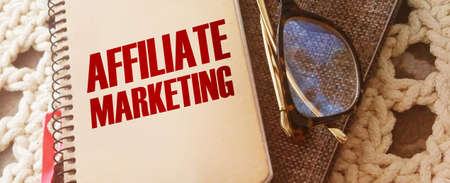 Notepad with words Affiliate marketing and glasses. Refferals marketing business conceptの写真素材